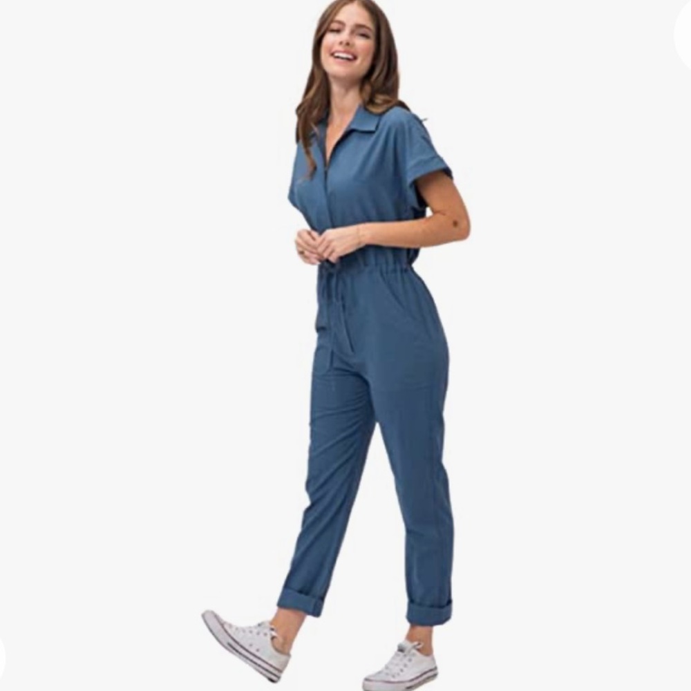 Blue coveralls jumpsuit with drawstring waist and pockets. Never worn. Small.